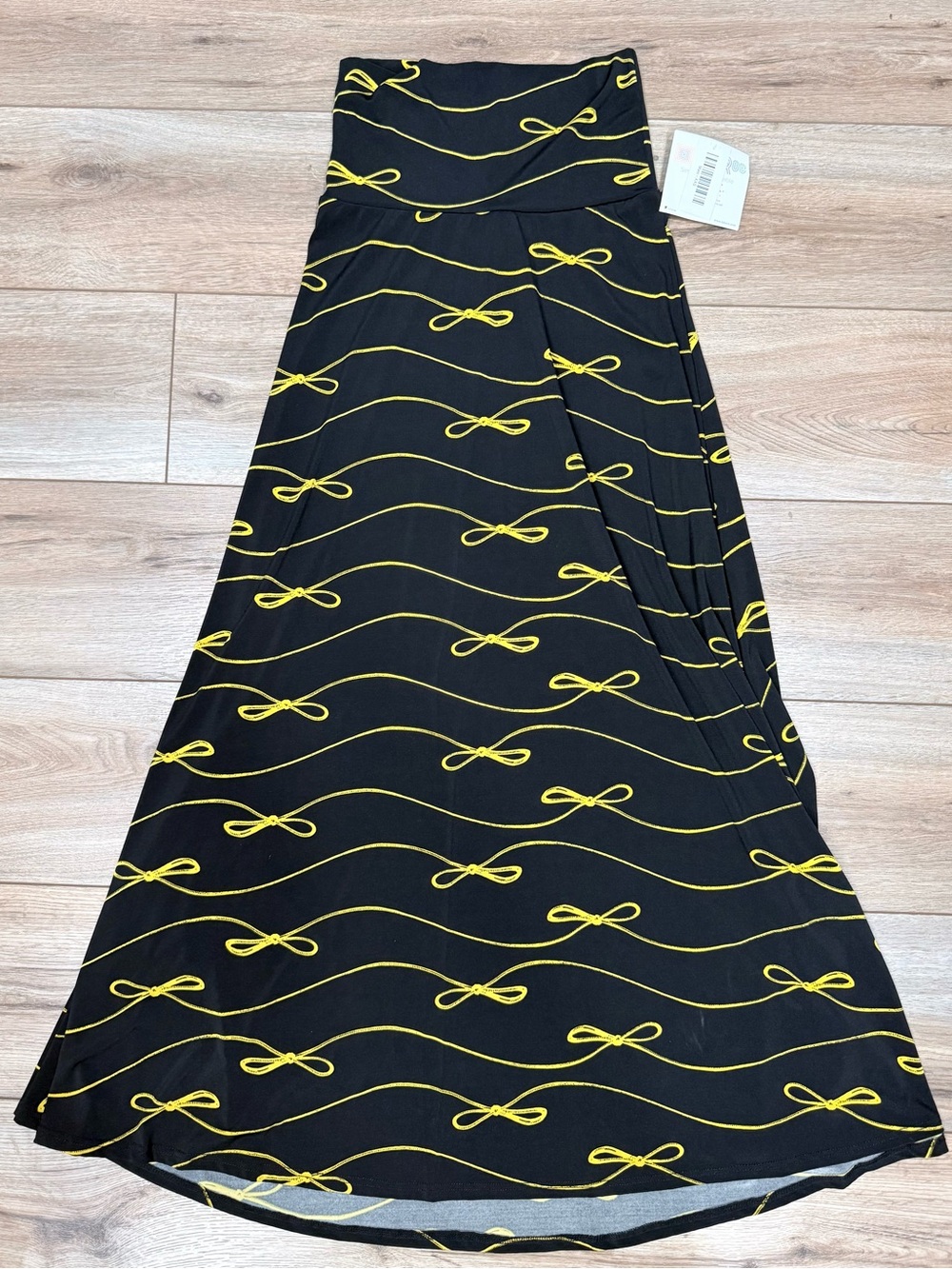 LuLaRoe Black Maxi Skirt with Yellow Bow Wave Print